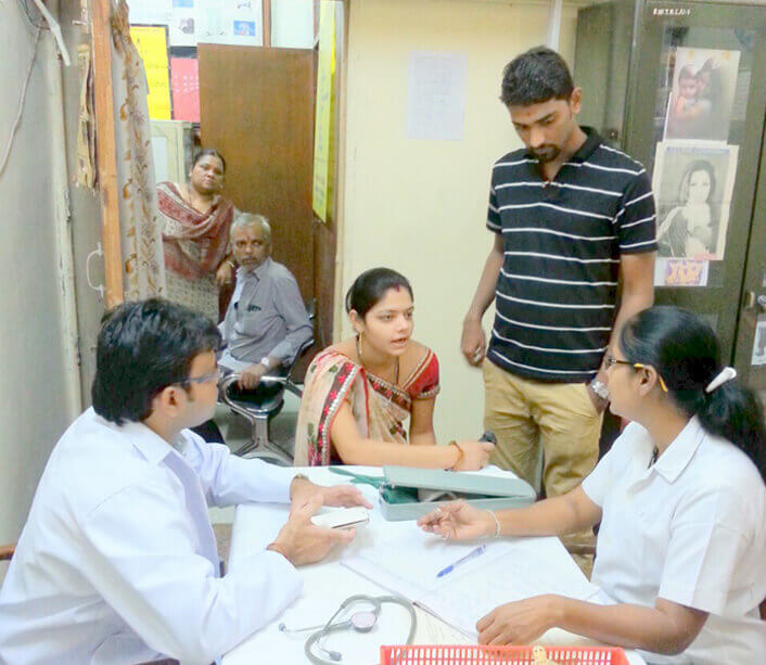 Dr. Amole Ade  with patients